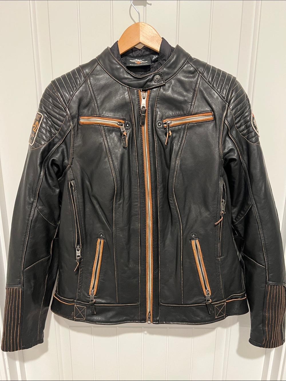 Harley-Davidson Women’s Large Black Leather Motorcycle Jacket with Orange Logo.
